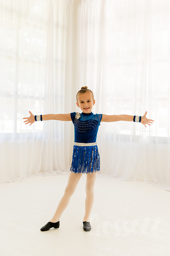 Ballerinas pose in a natural light studio