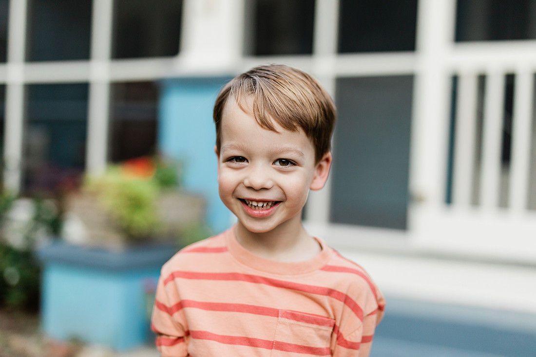 Golden hour family photos on west-facing porch with warm, flattering light for porch photography.
