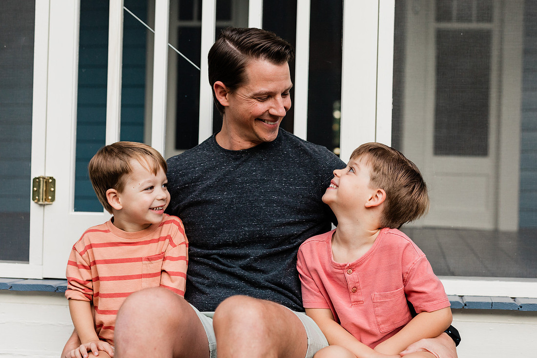 Golden hour family photos on west-facing porch with warm, flattering light for porch photography.