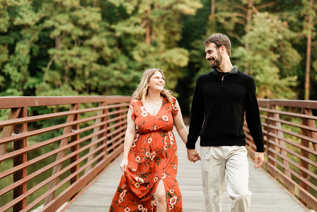 Outdoor maternity photography session with expecting parents captured in soft natural light