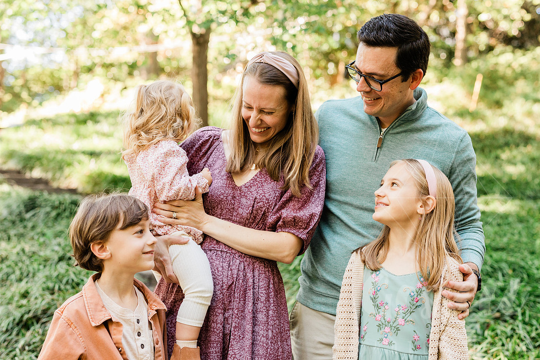 Outdoor spring family mini session capturing authentic smiles and connection