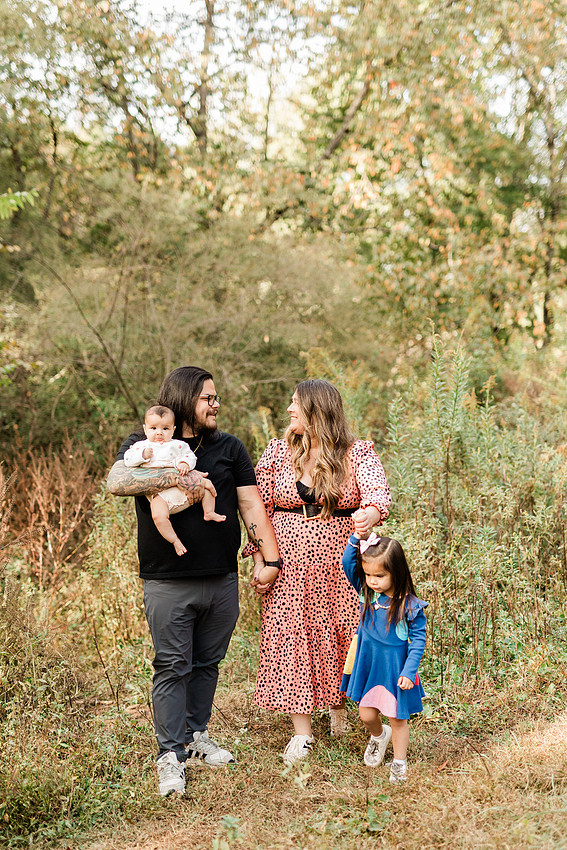 family of four connects while a photographer docoments the moment