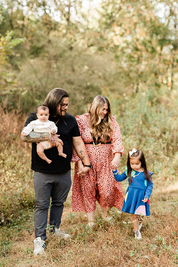 family of four connects while a photographer docoments the moment