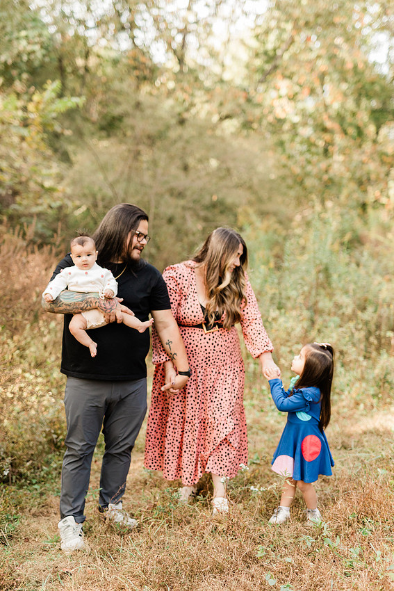 family of four connects while a photographer docoments the moment