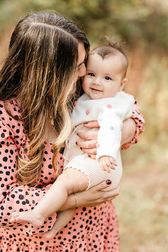 family of four connects while a photographer docoments the moment