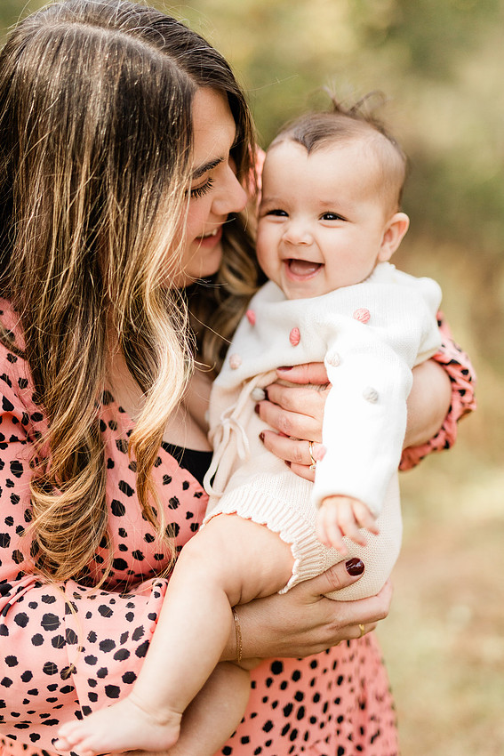 family of four connects while a photographer docoments the moment