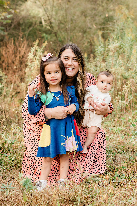 family of four connects while a photographer docoments the moment