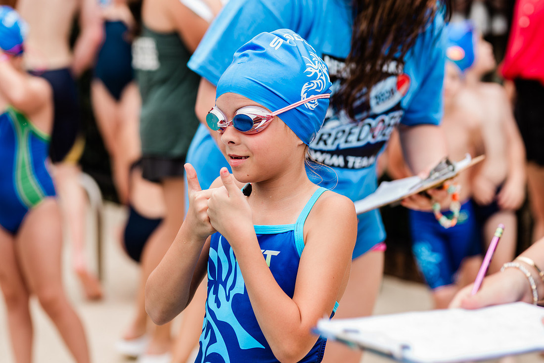 swimmers at swim meets and posing for portraits