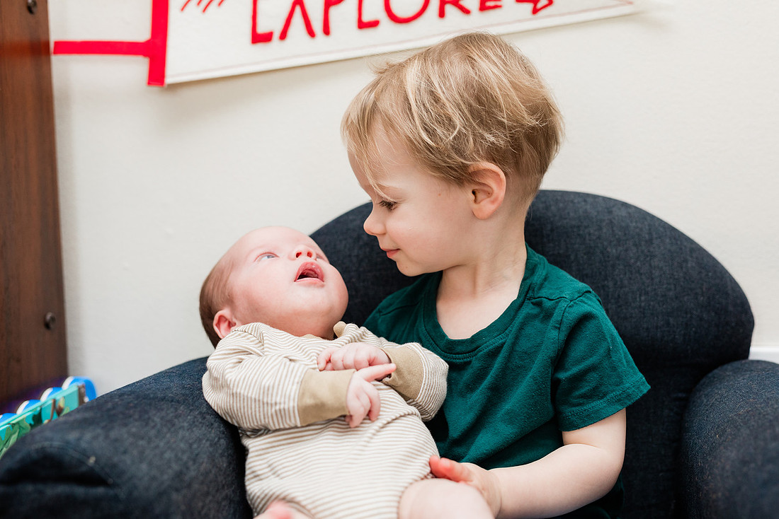 Family in their home welcoming baby