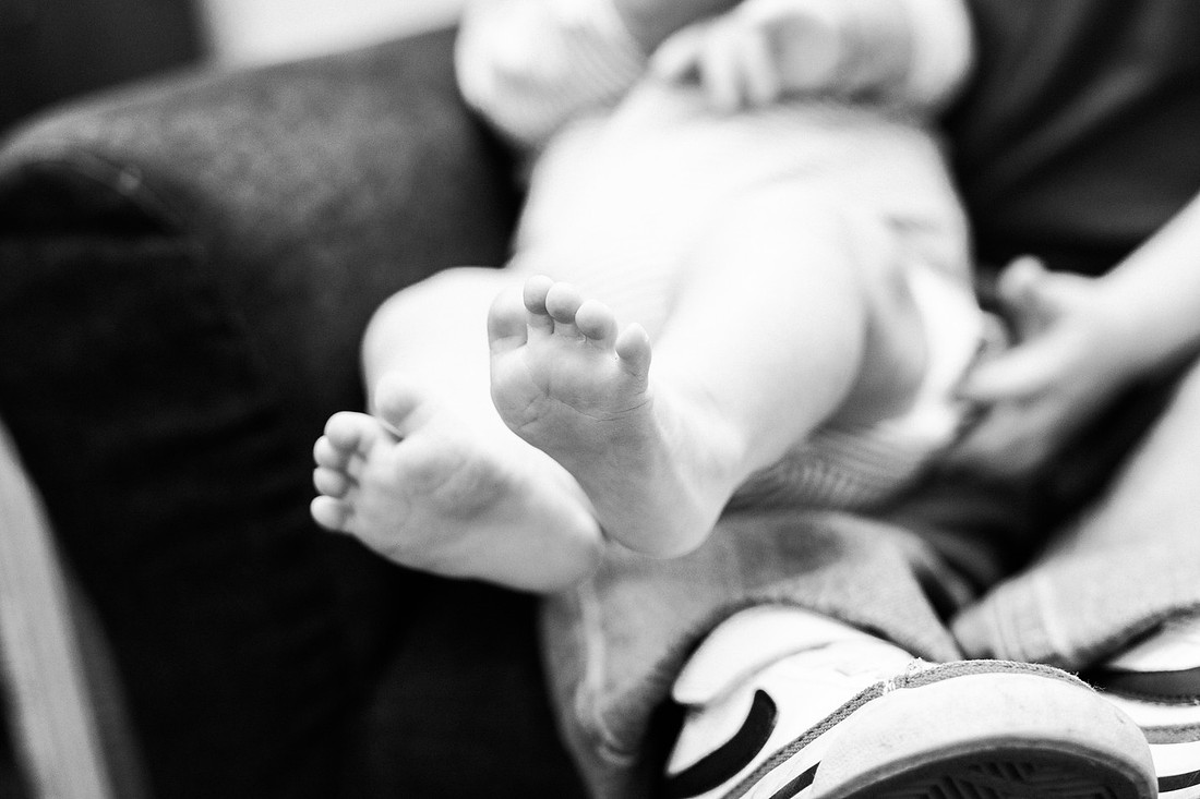 Family in their home welcoming baby
