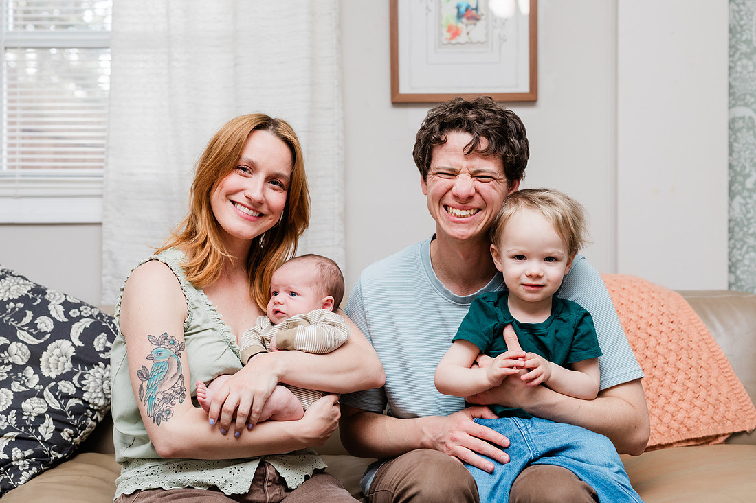 Family in their home welcoming baby