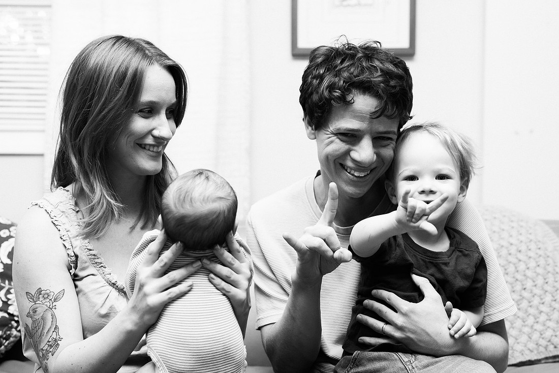 Family in their home welcoming baby