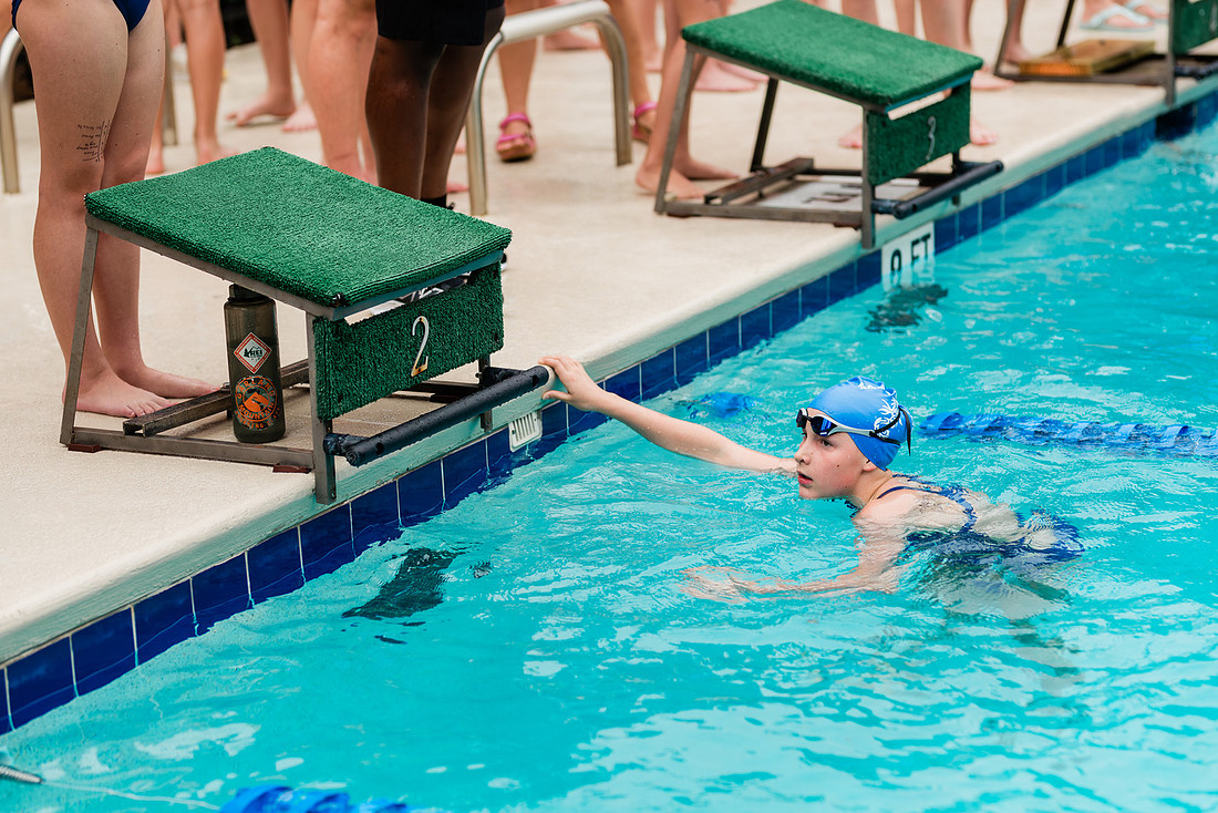 swimmers at swim meets and posing for portraits