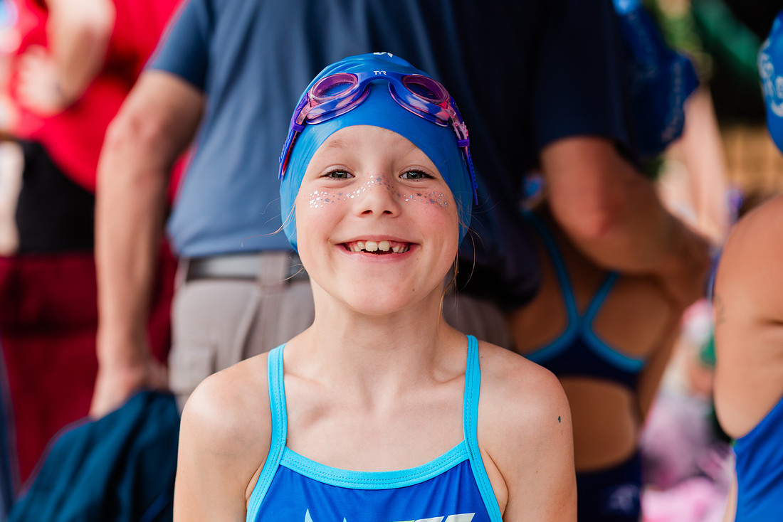 swimmers at swim meets and posing for portraits