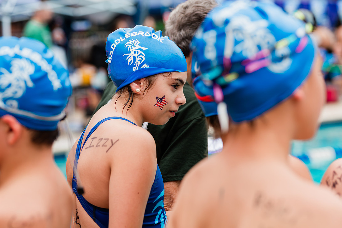 swimmers at swim meets and posing for portraits