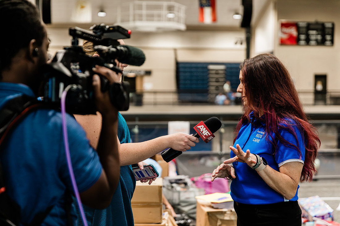 Scenes from KIDS CARE's Backing the Need backpack and school supply drive at the Cobb County Civic Center in Marietta, GA.