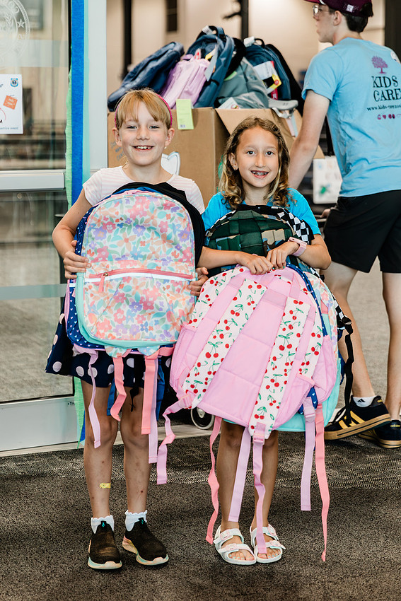 Scenes from KIDS CARE's Backing the Need backpack and school supply drive at the Cobb County Civic Center in Marietta, GA.
