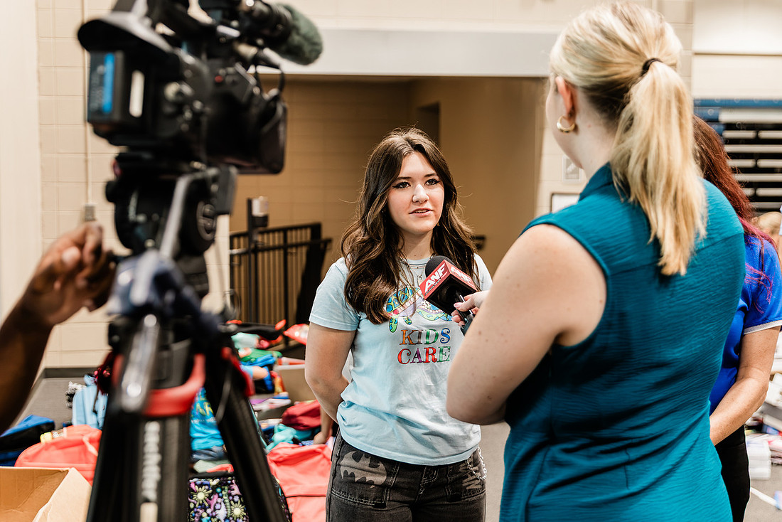 Scenes from KIDS CARE's Backing the Need backpack and school supply drive at the Cobb County Civic Center in Marietta, GA.