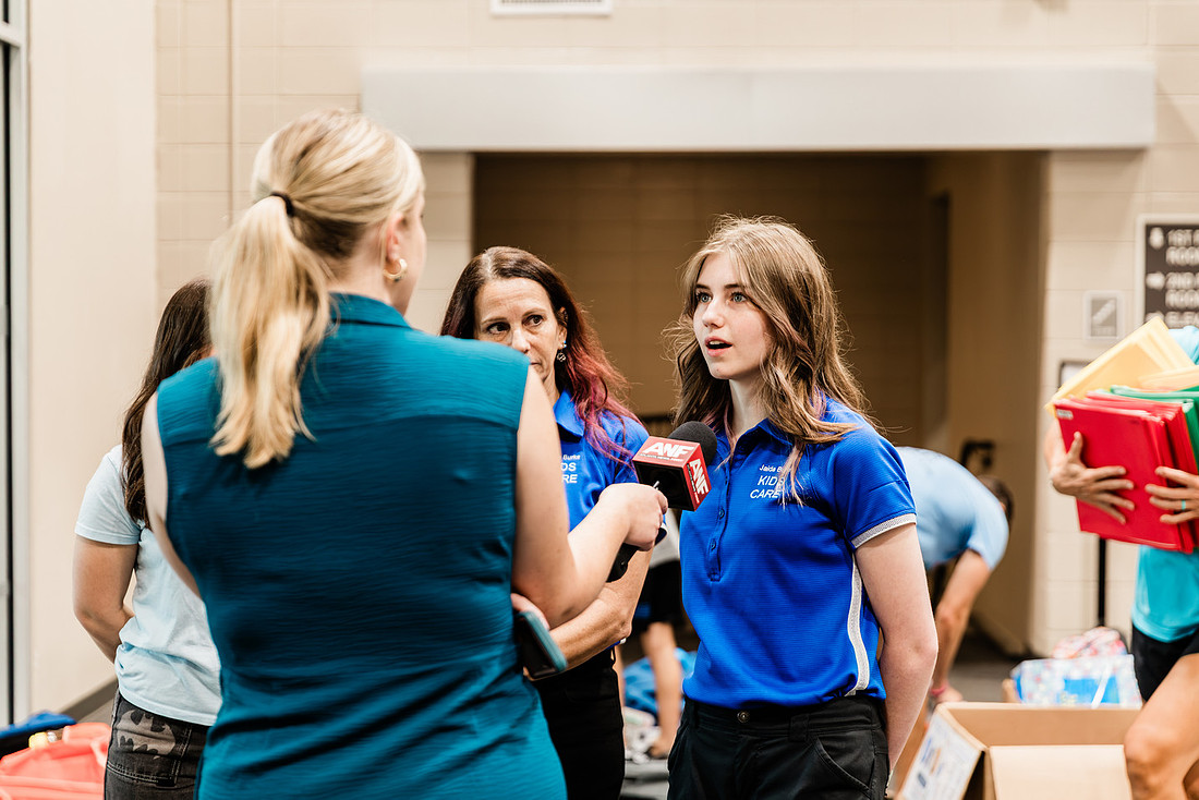 Scenes from KIDS CARE's Backing the Need backpack and school supply drive at the Cobb County Civic Center in Marietta, GA.