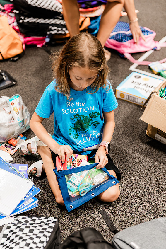 Scenes from KIDS CARE's Backing the Need backpack and school supply drive at the Cobb County Civic Center in Marietta, GA.