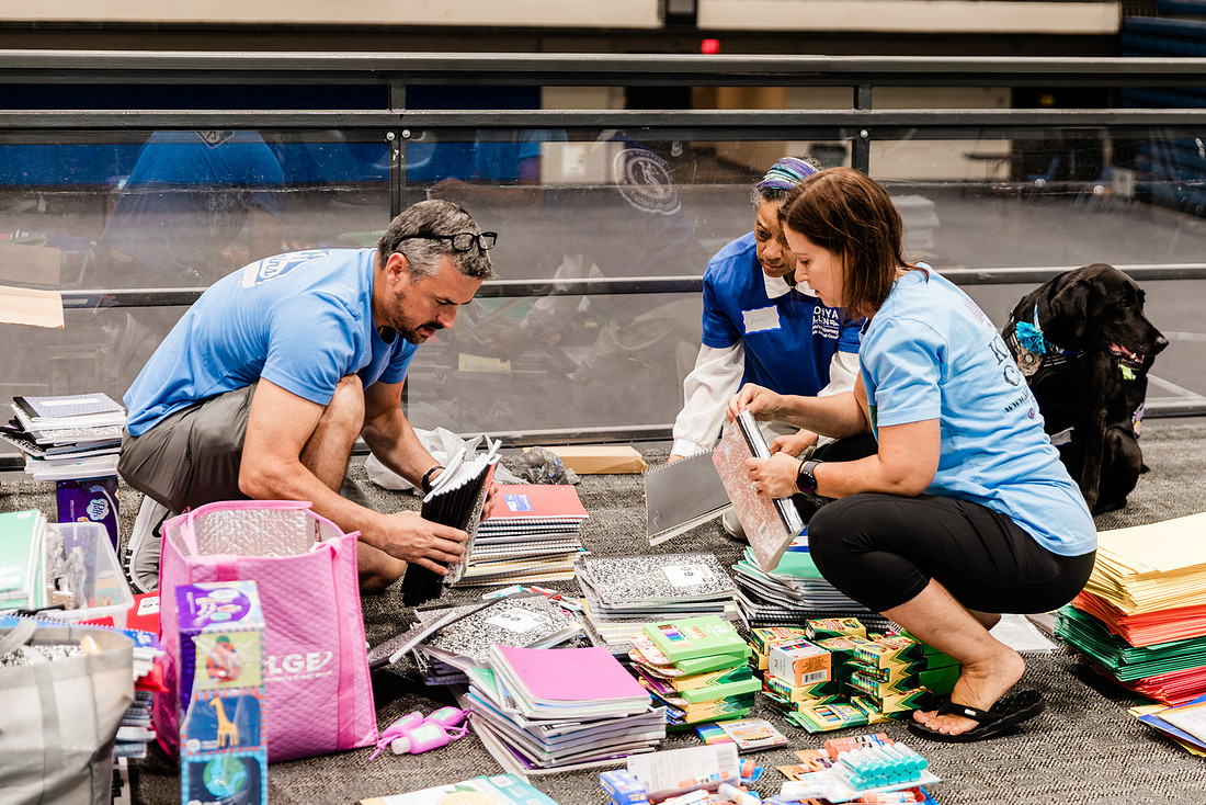 Scenes from KIDS CARE's Backing the Need backpack and school supply drive at the Cobb County Civic Center in Marietta, GA.