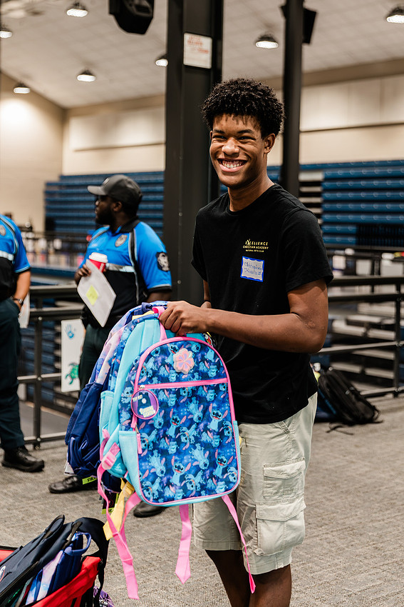 Scenes from KIDS CARE's Backing the Need backpack and school supply drive at the Cobb County Civic Center in Marietta, GA.