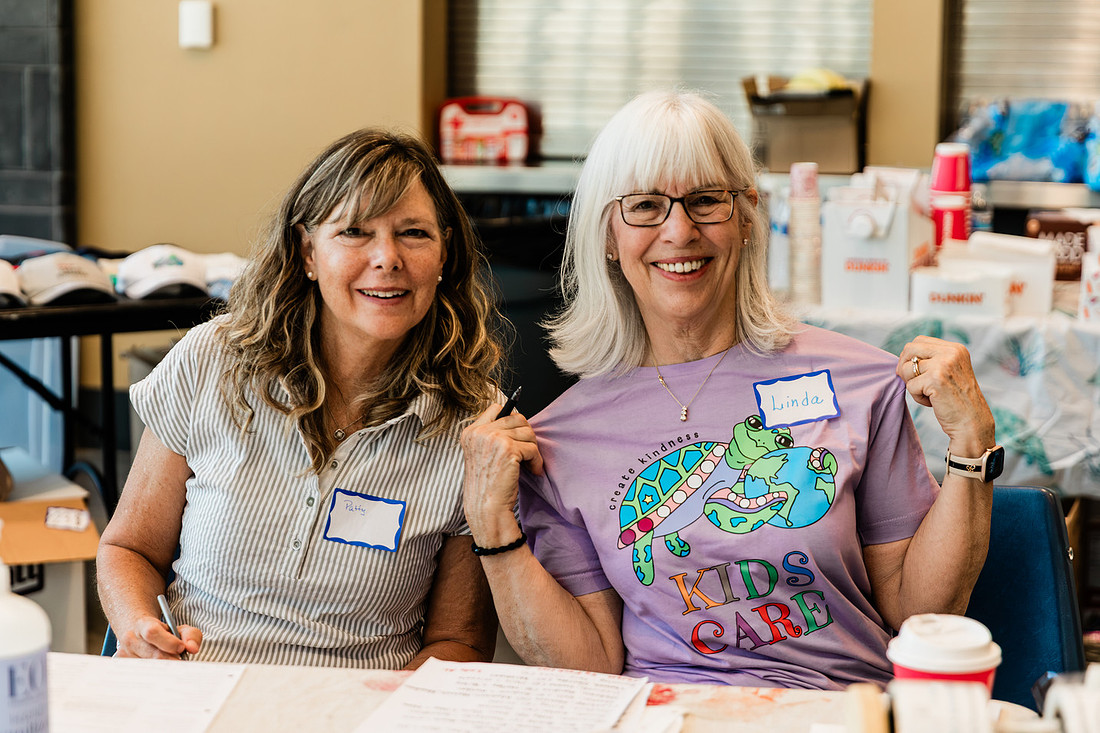 Scenes from KIDS CARE's Backing the Need backpack and school supply drive at the Cobb County Civic Center in Marietta, GA.