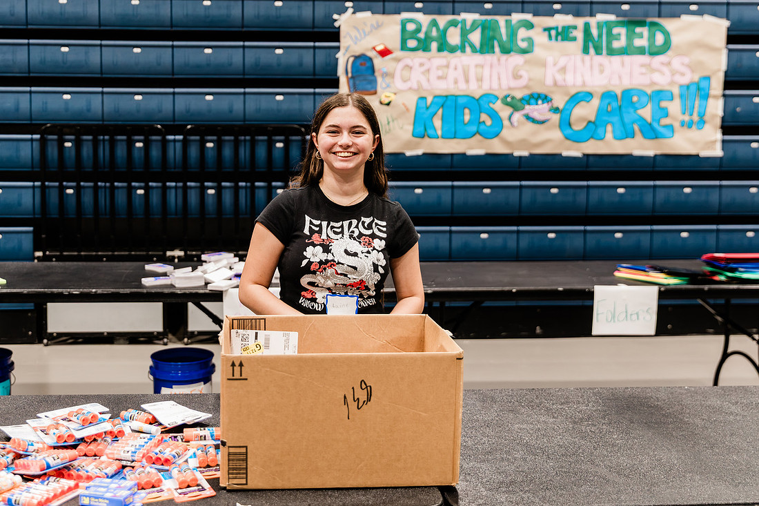 Scenes from KIDS CARE's Backing the Need backpack and school supply drive at the Cobb County Civic Center in Marietta, GA.