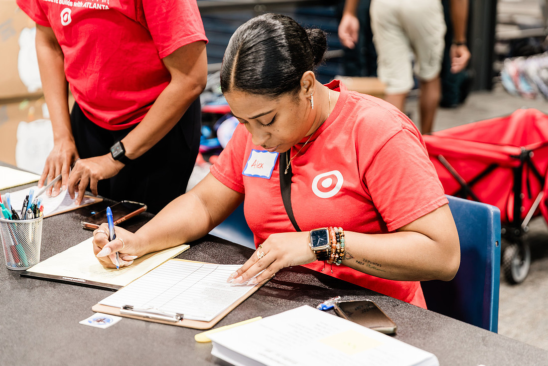 Scenes from KIDS CARE's Backing the Need backpack and school supply drive at the Cobb County Civic Center in Marietta, GA.