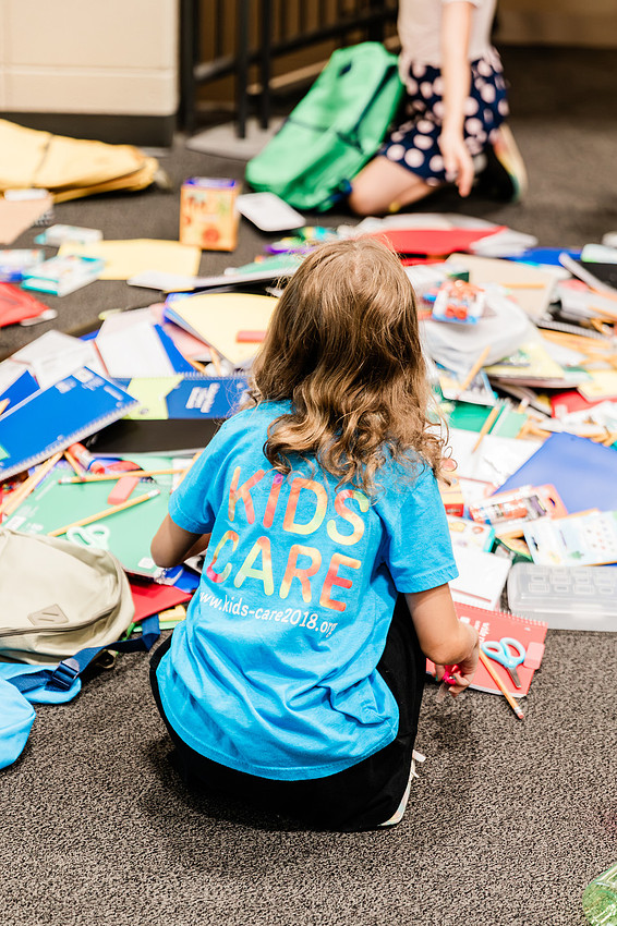 Scenes from KIDS CARE's Backing the Need backpack and school supply drive at the Cobb County Civic Center in Marietta, GA.