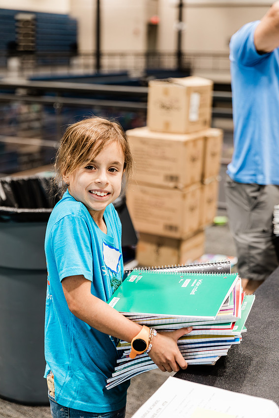 Scenes from KIDS CARE's Backing the Need backpack and school supply drive at the Cobb County Civic Center in Marietta, GA.
