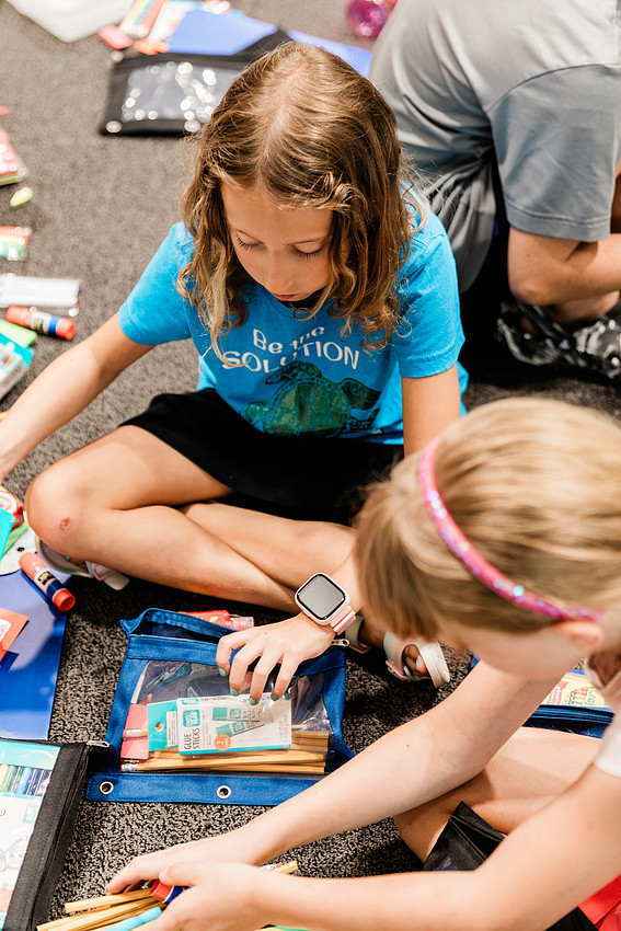 Scenes from KIDS CARE's Backing the Need backpack and school supply drive at the Cobb County Civic Center in Marietta, GA.