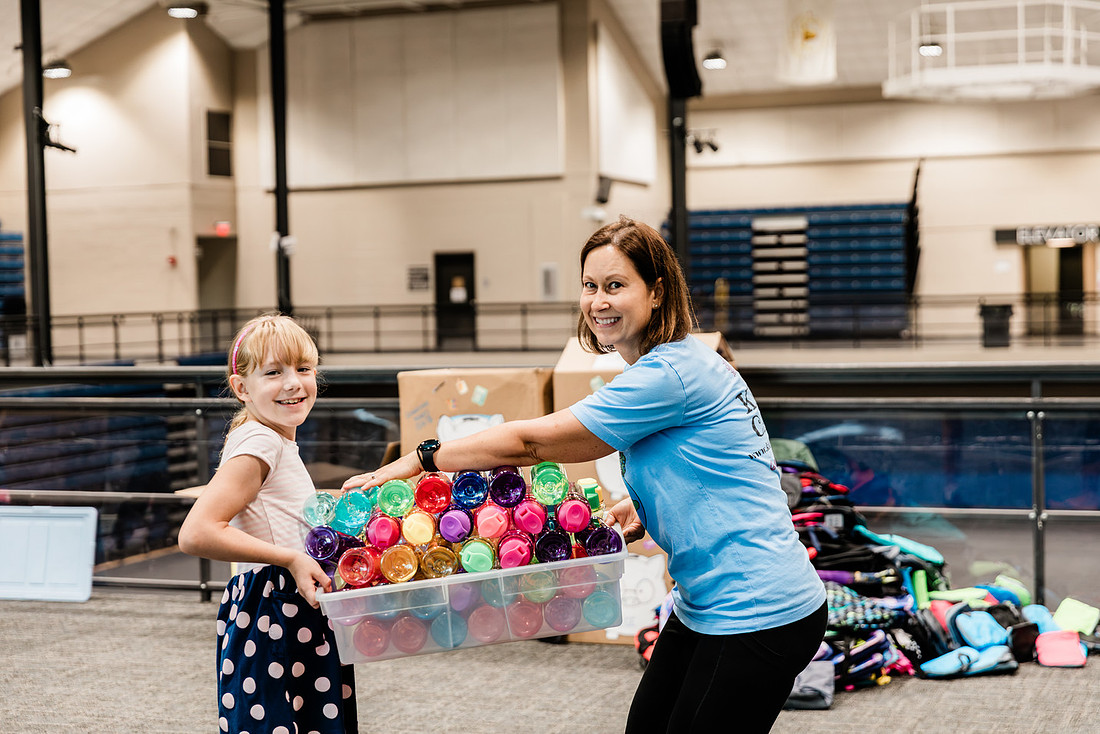 Scenes from KIDS CARE's Backing the Need backpack and school supply drive at the Cobb County Civic Center in Marietta, GA.