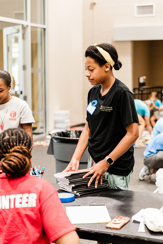 Scenes from KIDS CARE's Backing the Need backpack and school supply drive at the Cobb County Civic Center in Marietta, GA.