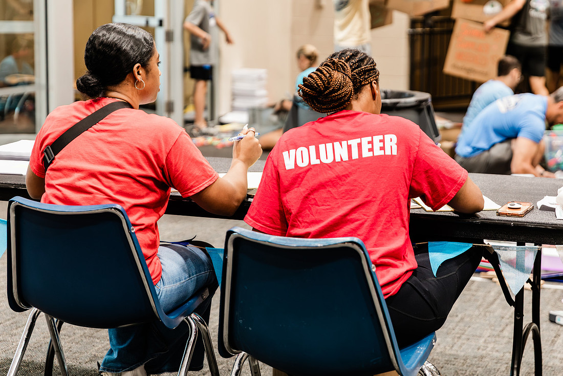 Scenes from KIDS CARE's Backing the Need backpack and school supply drive at the Cobb County Civic Center in Marietta, GA.