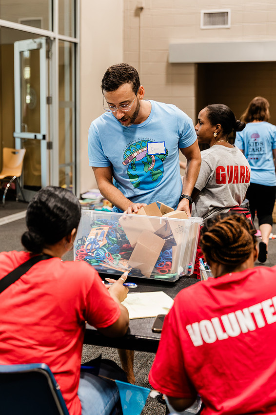 Scenes from KIDS CARE's Backing the Need backpack and school supply drive at the Cobb County Civic Center in Marietta, GA.
