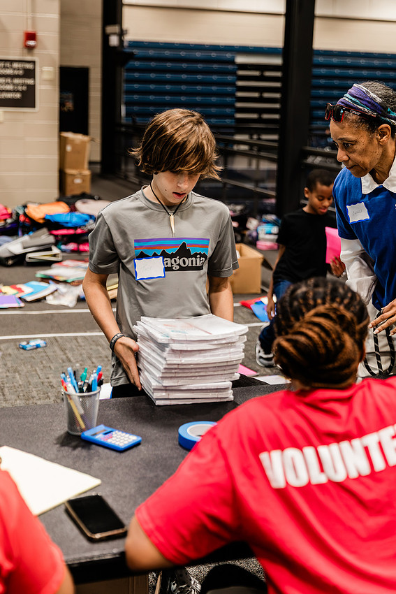 Scenes from KIDS CARE's Backing the Need backpack and school supply drive at the Cobb County Civic Center in Marietta, GA.