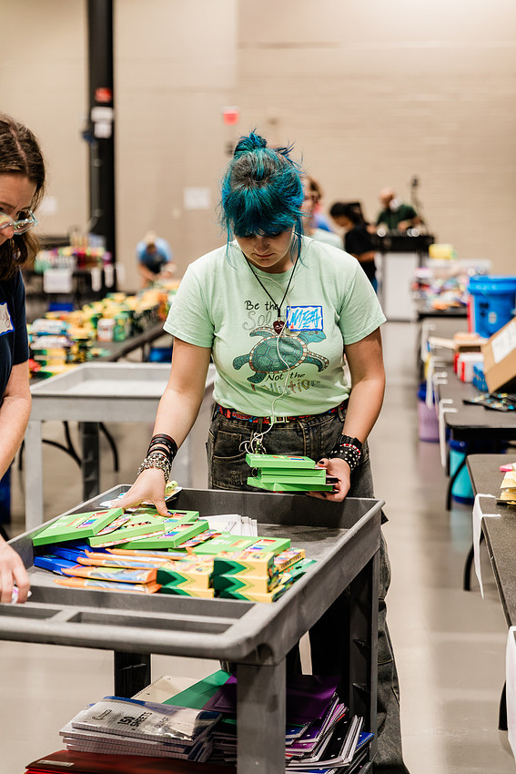 Scenes from KIDS CARE's Backing the Need backpack and school supply drive at the Cobb County Civic Center in Marietta, GA.