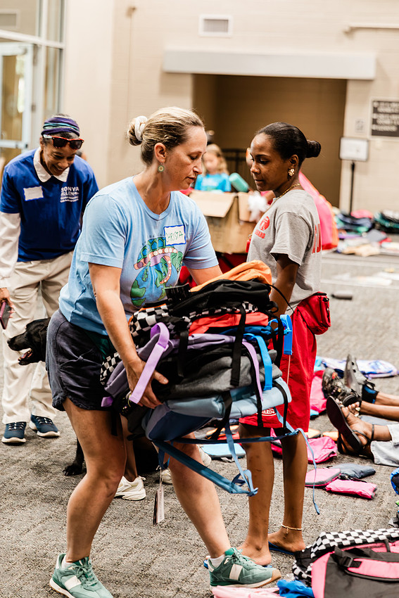 Scenes from KIDS CARE's Backing the Need backpack and school supply drive at the Cobb County Civic Center in Marietta, GA.