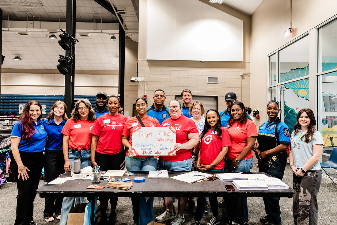Scenes from KIDS CARE's Backing the Need backpack and school supply drive at the Cobb County Civic Center in Marietta, GA.