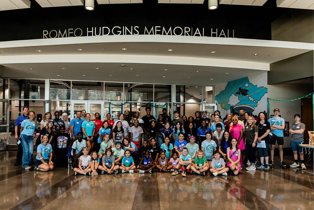 Scenes from KIDS CARE's Backing the Need backpack and school supply drive at the Cobb County Civic Center in Marietta, GA.