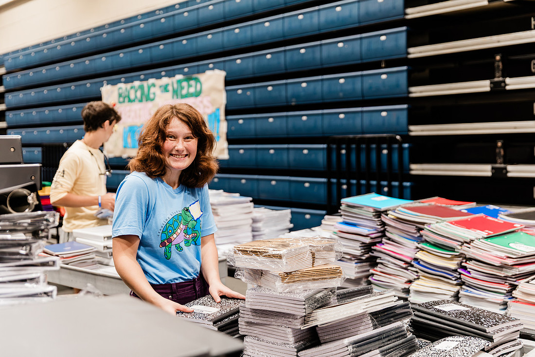 Scenes from KIDS CARE's Backing the Need backpack and school supply drive at the Cobb County Civic Center in Marietta, GA.