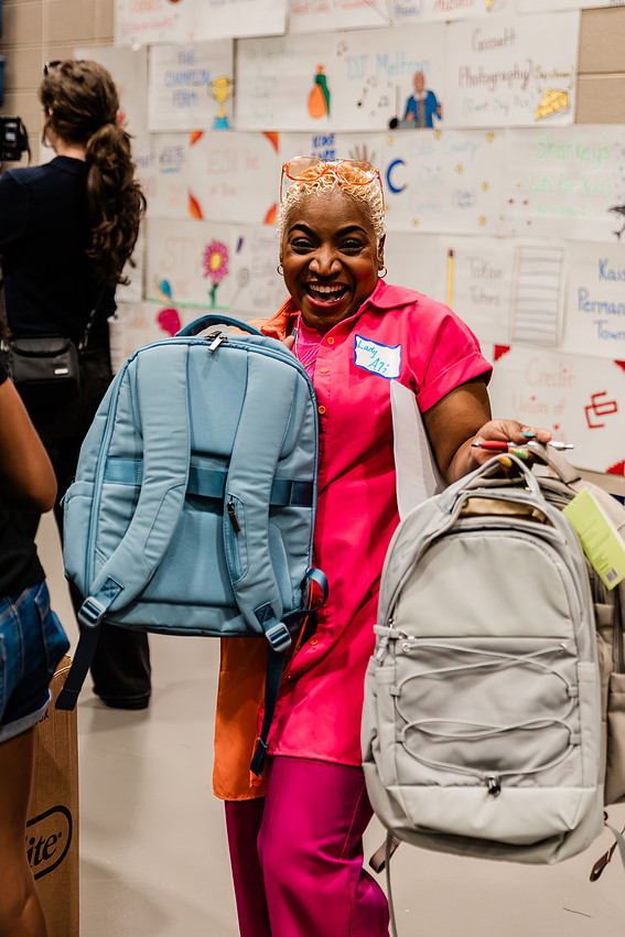 Scenes from KIDS CARE's Backing the Need backpack and school supply drive at the Cobb County Civic Center in Marietta, GA.