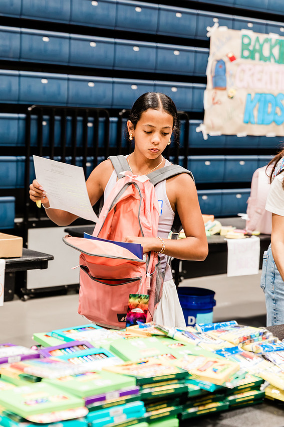 Scenes from KIDS CARE's Backing the Need backpack and school supply drive at the Cobb County Civic Center in Marietta, GA.
