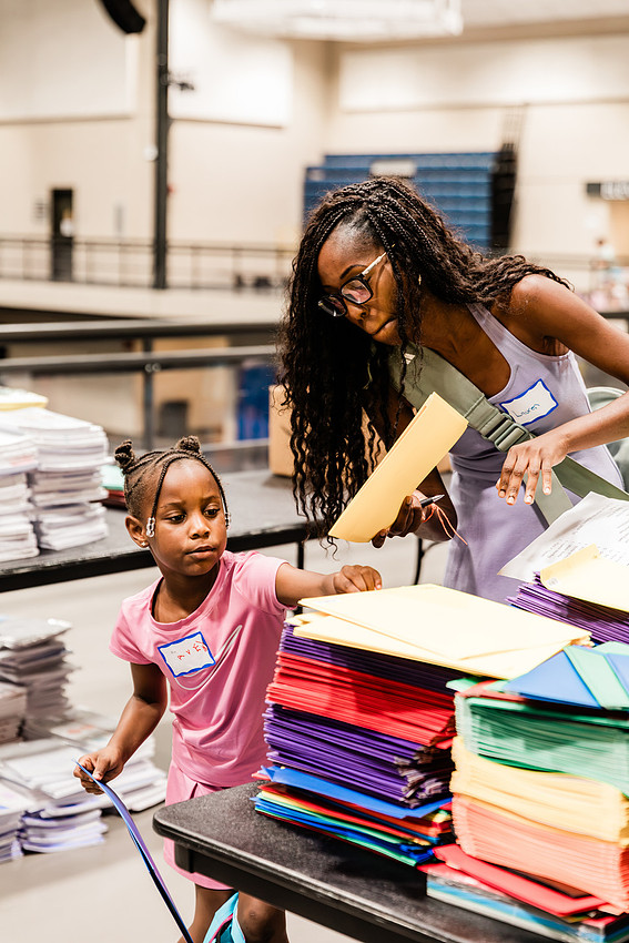 Scenes from KIDS CARE's Backing the Need backpack and school supply drive at the Cobb County Civic Center in Marietta, GA.
