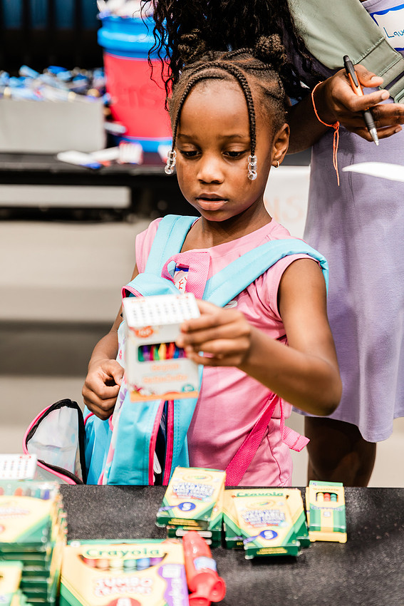 Scenes from KIDS CARE's Backing the Need backpack and school supply drive at the Cobb County Civic Center in Marietta, GA.
