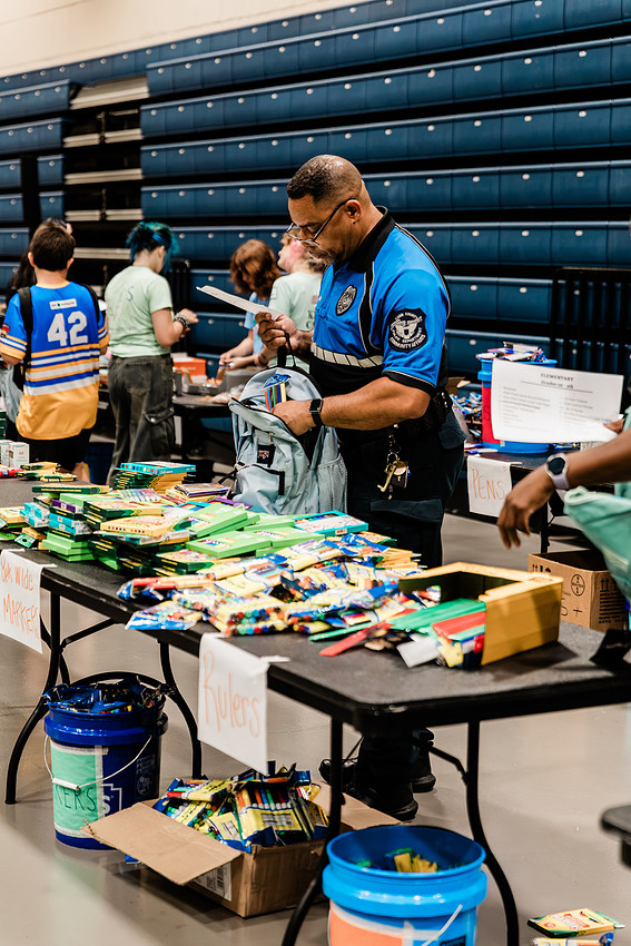 Scenes from KIDS CARE's Backing the Need backpack and school supply drive at the Cobb County Civic Center in Marietta, GA.