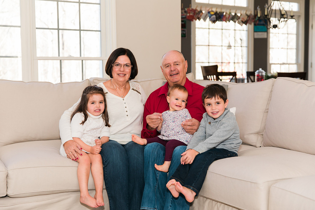 Family gathers around in home for the holiday season