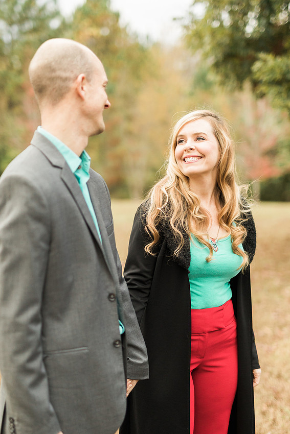 Family smiles for both posed and candid photos in a park