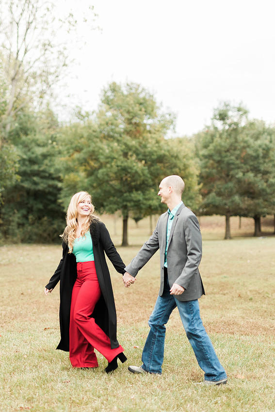 Family smiles for both posed and candid photos in a park